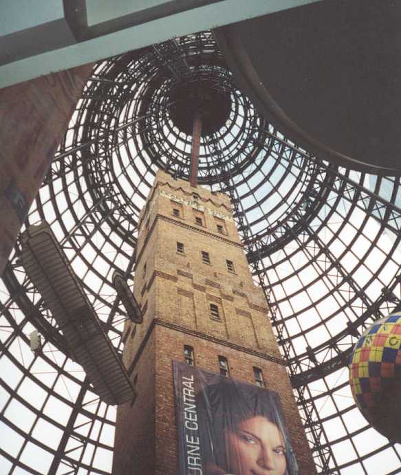 The shot tower with the shopping centre dome above it.