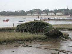 P2002B120020	A boat buried in the mud at Felixstowe Ferry. 