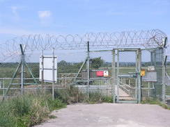 P20086095019	The gate leading out of the MOD area on Thorney Island.