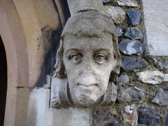 P2012DSC03856	A figure on the doorway of Chipping Ongar church.