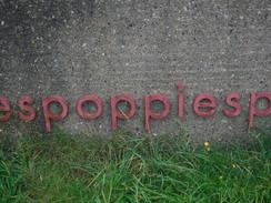 P2019DSCF3258	A 'poppies' sign in Skeelingthorpe, part of a war memorial.