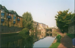 E01	The canal at Mile End. Mile End lock is in the picture, with QMW Halls of Residences to the left.