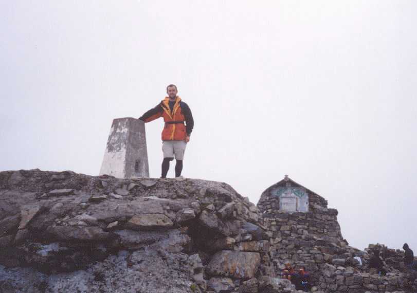Myself standing at the trig point on Ben Nevis.