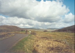 AT20	Looking west along the A837 road towards Lubcroy and Mullach Chonachair.
