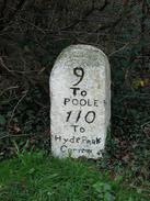 P2002C310055	A milestone outside Wareham - Hyde Park Corner, 110 miles! 