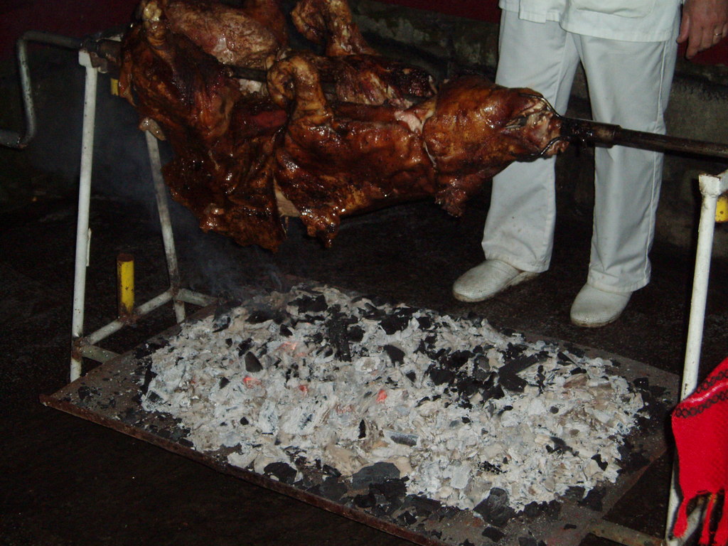 The pig being roasted.