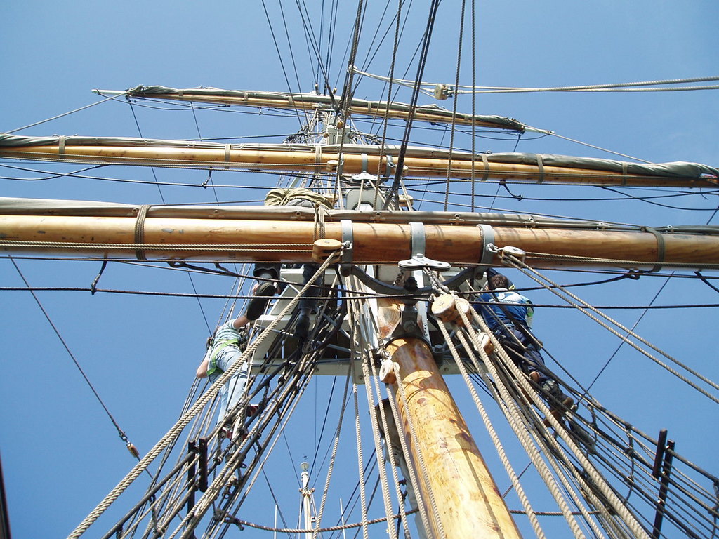 Doing the 'up and over' on the main mast.