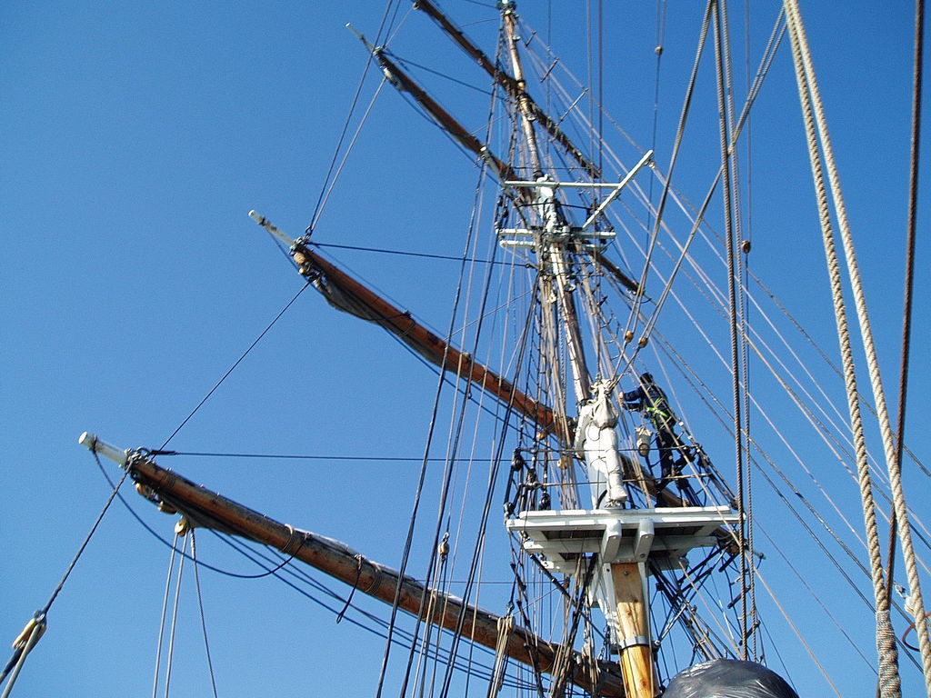 Someone climbing the fore mast.