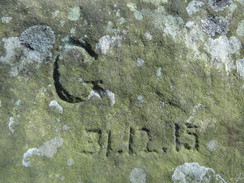 P2013DSC05018	An engraving on a stone on the edge of Stanton Moor.