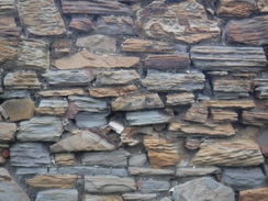 P2020DSCF4678	An eroded stone wall near Woodhouse station.