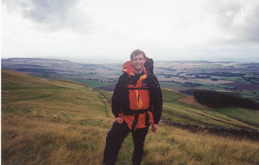 Myself on the descent from Wideopen Hill. In the background is the ground that I would walk over in the next two days.