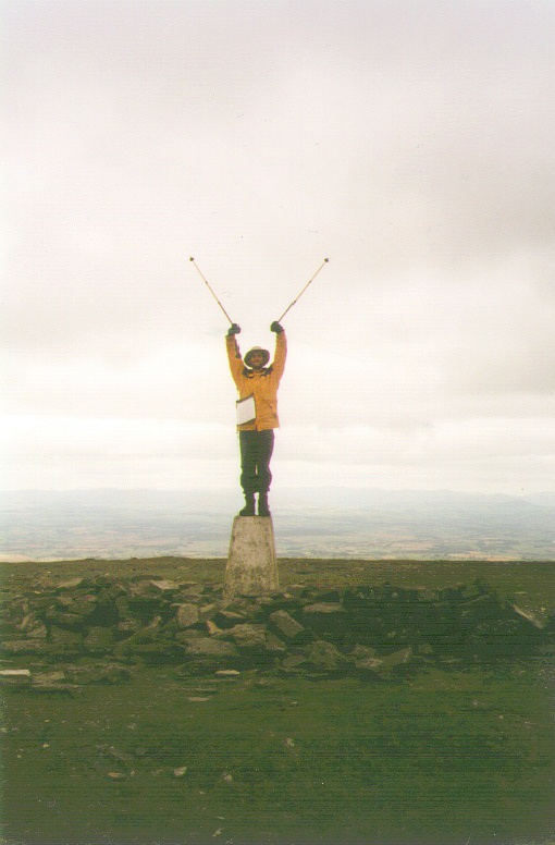 Myself standing on the Trig Point on Cross Fell, the highest point of the Pennines.